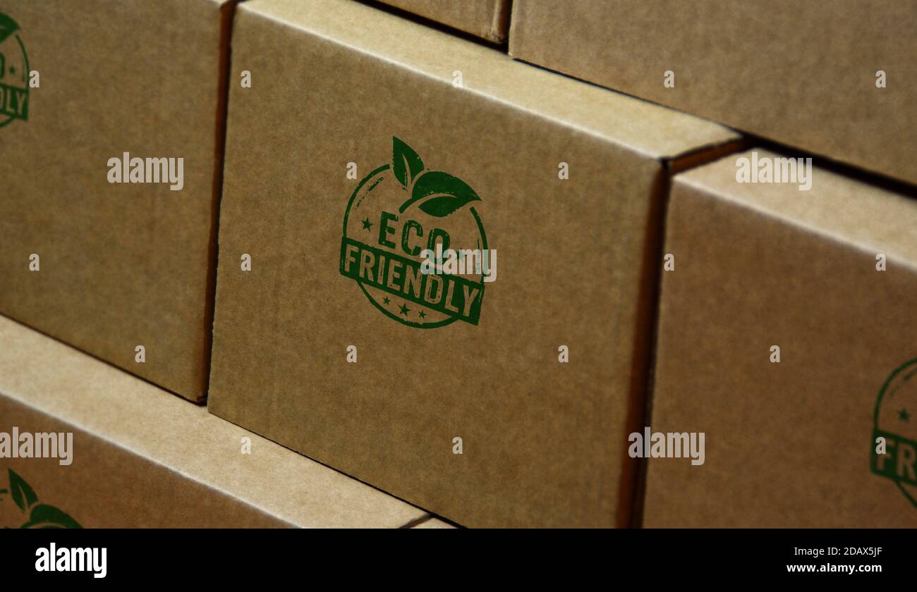 Eco friendly stamp printed on cardboard box. Sustainable economy, green, environment, ecology, organic, healthy food and natural life style concept.` Stock Photo